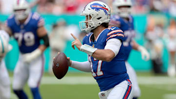Buffalo Bills quarterback Josh Allen scrambles during the first half against the Miami Dolphins at Hard Rock Stadium.