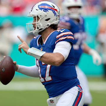 Buffalo Bills quarterback Josh Allen scrambles during the first half against the Miami Dolphins at Hard Rock Stadium.