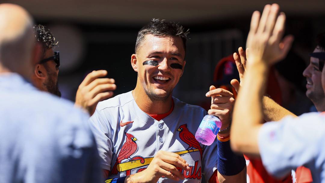 Aug 31, 2025; Cincinnati, Ohio, USA; St. Louis Cardinals outfielder Lars Nootbaar (21) high fives teammates after scoring on a sacrifice fly out hit by designated hitter Ivan Herrera (not pictured) in the third inning against the Cincinnati Reds at Great American Ball Park. Mandatory Credit: Katie Stratman-Imagn Images
