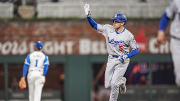 May 3, 2025; Cumberland, Georgia, USA; Los Angeles Dodgers first baseman Freddie Freeman (5) reacts after hitting a three run home run against the Atlanta Braves during the eighth inning at Truist Park. Mandatory Credit: Dale Zanine-Imagn Images