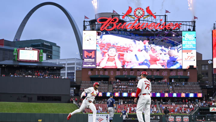 Aug 6, 2024; St. Louis, Missouri, USA;  St. Louis Cardinals center fielder Victor Scott II (11) celebrates with third base coach Ron 'Pop' Warner (75) after hitting a two run home run against the Tampa Bay Rays during the second inning at Busch Stadium. Mandatory Credit: Jeff Curry-USA TODAY Sports