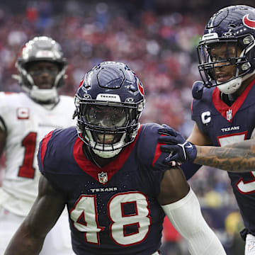 Nov 5, 2023; Houston, Texas, USA; Houston Texans linebacker Christian Harris (48) and safety Jalen Pitre (5) react after a defensive play at NRG Stadium. Mandatory Credit: Troy Taormina-Imagn Images