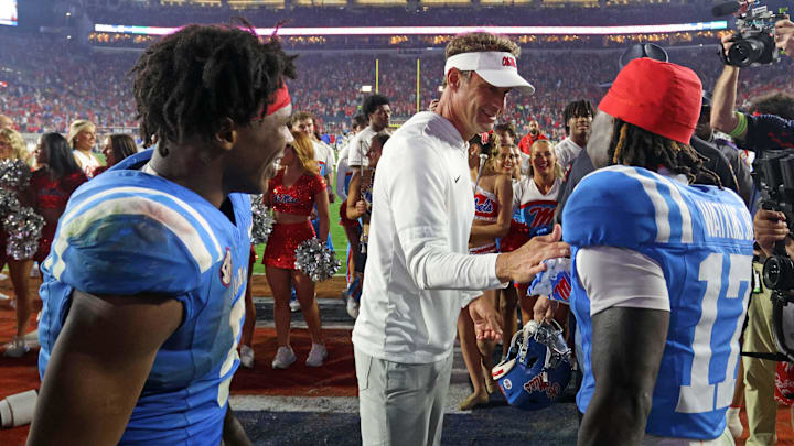 Nov 15, 2025; Oxford, Mississippi, USA; Mississippi Rebels head coach Lane Kiffin reacts with Mississippi Rebels wide receiver Winston Watkins (17) after defeating the Florida Gators at Vaught-Hemingway Stadium. Mandatory Credit: Petre Thomas-Imagn Images
