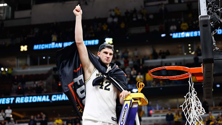 Mar 29, 2026; Chicago, IL, USA; Michigan Wolverines forward Will Tschetter (42) cuts the net after defeating Tennessee Volunteers in an Elite Eight game of the Midwest Regional of the men's 2026 NCAA Tournament at United Center. Mandatory Credit: Kamil Krzaczynski-Imagn Images
