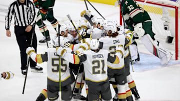 Apr 26, 2025; Saint Paul, Minnesota, USA; Vegas Golden Knights center Ivan Barbashev (49) celebrates with teammates after he puts the puck past Minnesota Wild goaltender Filip Gustavsson (32) during 1st OT in game four of the first round of the 2025 Stanley Cup Playoffs at Xcel Energy Center. Vegas Golden Knights win 4-3. Mandatory Credit: Bruce Fedyck-Imagn Images