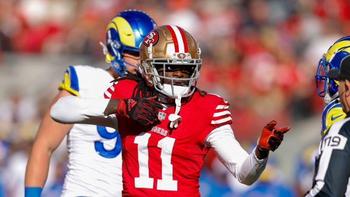 Jan 7, 2024; Santa Clara, California, USA; San Francisco 49ers wide receiver Brandon Aiyuk (11) celebrates after a play against the Los Angeles Rams during the first quarter at Levi's Stadium. Mandatory Credit: Sergio Estrada-USA TODAY Sports