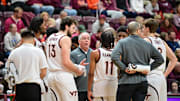 Mar 1, 2025; Blacksburg, Virginia, USA;  Virginia Tech Hokies head coach Mike Young talks to his team during a timeout during the second half against Syracuse Orange at Cassell Coliseum. Mandatory Credit: Brian Bishop-Imagn Images
