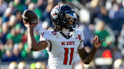Oct 11, 2025; South Bend, Indiana, USA; NC State Wolfpack quarterback CJ Bailey (11) throws a pass against the Notre Dame Fighting Irish during the first half at Notre Dame Stadium. Mandatory Credit: Michael Caterina-Imagn Images