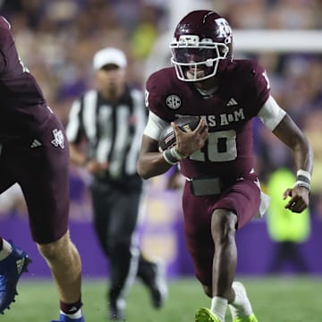 Oct 25, 2025; Baton Rouge, Louisiana, USA; Texas A&M Aggies quarterback Marcel Reed (10) scrambles during the second half against the Louisiana State Tigers at Tiger Stadium. Mandatory Credit: Stephen Lew-Imagn Images