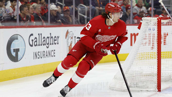 Mar 27, 2025; Detroit, Michigan, USA;  Detroit Red Wings defenseman Moritz Seider (53) skates with the puck in the third period against the Ottawa Senators at Little Caesars Arena. Mandatory Credit: Rick Osentoski-Imagn Images