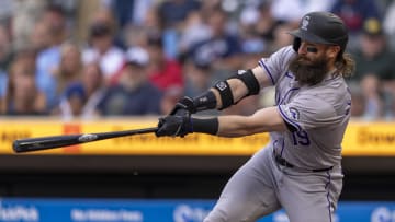 Jun 10, 2024; Minneapolis, Minnesota, USA; Colorado Rockies designated hitter Charlie Blackmon (19) hits a single against the Minnesota Twins in the first inning at Target Field.
