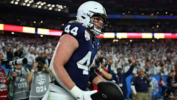 Dec 31, 2024; Glendale, AZ, USA; Penn State Nittany Lions tight end Tyler Warren (44) reacts after scoring a touchdown against the Boise State Broncos during the first half in the Fiesta Bowl at State Farm Stadium. Mandatory Credit: Mark J. Rebilas-Imagn Images