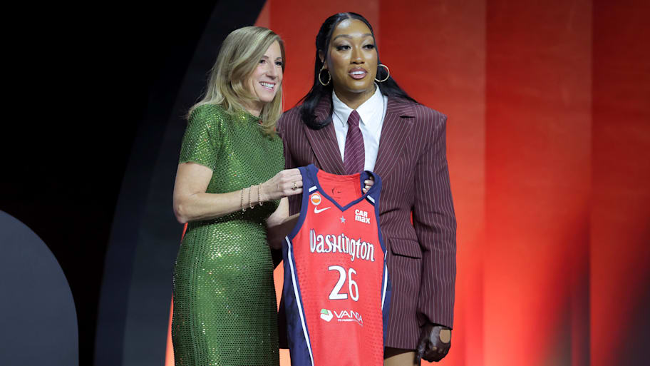 WNBA Commissioner Cathy Engelbert (left) poses for photos with Cotie McMahon who was selected eleventh overall by the Mystics