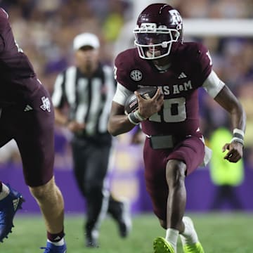 Oct 25, 2025; Baton Rouge, Louisiana, USA; Texas A&M Aggies quarterback Marcel Reed (10) scrambles during the second half against the Louisiana State Tigers at Tiger Stadium. Mandatory Credit: Stephen Lew-Imagn Images