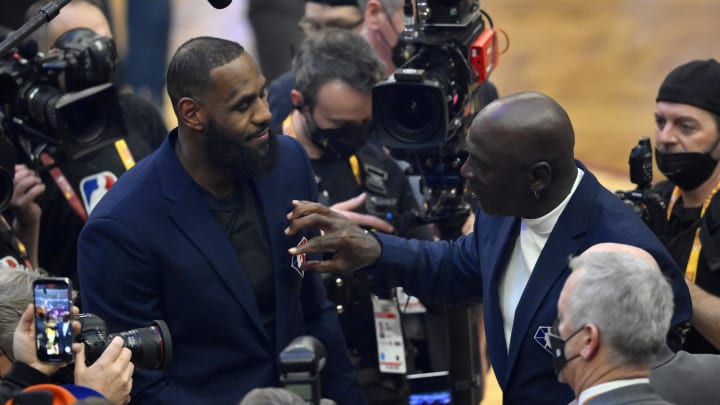 Feb 20, 2022; Cleveland, Ohio, USA; LeBron James and Michael Jordan on court during halftime during the 2022 NBA All-Star Game at Rocket Mortgage FieldHouse. 