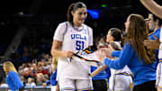 Mar 23, 2025; Los Angeles, California, USA; UCLA Bruins center Lauren Betts (51) and UCLA Bruins guard Kiki Rice (background) go to the bench in the closing minutes of the Bruins win over Richmond Spiders during an NCAA Tournament second round game at Pauley Pavilion presented by Wescom. Mandatory Credit: Robert Hanashiro-Imagn Images
