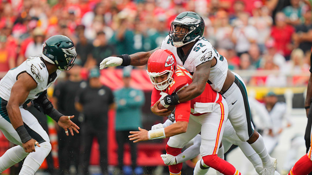 Sep 14, 2025; Kansas City, Missouri, USA; Philadelphia Eagles defensive end Za'Darius Smith (52) sacks Kansas City Chiefs quarterback Patrick Mahomes (15) during the second quarter of the game at GEHA Field at Arrowhead Stadium. Mandatory Credit: Jay Biggerstaff-Imagn Images