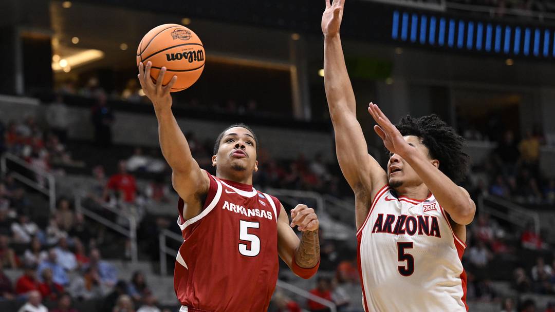Mar 26, 2026; San Jose, CA, USA; Arkansas Razorbacks guard Darius Acuff Jr. (5) shoots past Arizona Wildcats guard Brayden Burries (5) in the second half during a Sweet Sixteen game of the West Regional of the men's 2026 NCAA Tournament at SAP Center. Mandatory Credit: Eakin Howard-Imagn Images