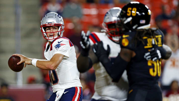 Aug 25, 2024; Landover, Maryland, USA; New England Patriots quarterback Drake Maye (10) throws a pass during the first quarter against the Washington Commanders during a preseason game at Commanders Field. Mandatory Credit: Peter Casey-USA TODAY Sports