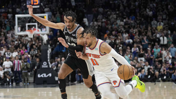 Mar 29, 2024; San Antonio, Texas, USA; New York Knicks guard Jalen Brunson (11) drives to the basket while defended by San Antonio Spurs guard Tre Jones (33) during overtime at Frost Bank Center. Mandatory Credit: Scott Wachter-USA TODAY Sports