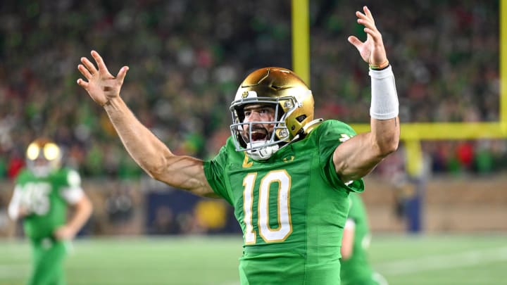 Sep 23, 2023; South Bend, Indiana, USA; Notre Dame Fighting Irish quarterback Sam Hartman (10) celebrates after throwing a fourth quarter touchdown pass against the Ohio State Buckeyes at Notre Dame Stadium. Mandatory Credit: Matt Cashore-USA TODAY Sports