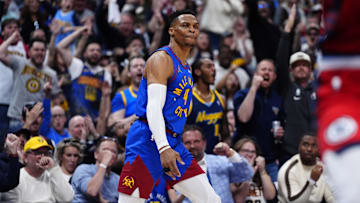 May 3, 2025; Denver, Colorado, USA; Denver Nuggets guard Russell Westbrook (4) reacts after a three point score in the second quarter against the LA Clippers during game seven of first round for the 2025 NBA Playoffs at Ball Arena. Mandatory Credit: Ron Chenoy-Imagn Images