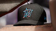 Apr 11, 2019; Cincinnati, OH, USA; A view of a New Era Miami Marlins hat in the dugout during the game against the Cincinnati Reds at Great American Ball Park.