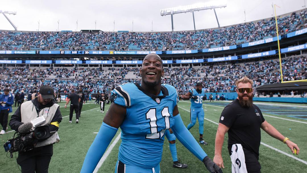 Oct 12, 2025; Charlotte, North Carolina, USA; Carolina Panthers linebacker Nic Scourton (11) looks on after the game against the Dallas Cowboys at Bank of America Stadium. Mandatory Credit: Scott Kinser-Imagn Images