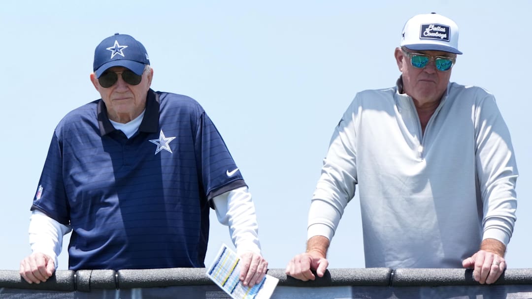 Jul 22, 2025; Oxnard, CA, USA; Dallas Cowboys owner Jerry Jones (center) watches with grandson John Stephen Jones (left) and son Stephen Jones during training camp at the River Ridge Fields. Mandatory Credit: Kirby Lee-Imagn Images