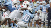 Houston Cougars defensive lineman Eddie Walls III (90) tackles Rice Owls running back Quinton Jackson (10) during the first quarter at Rice Stadium.
