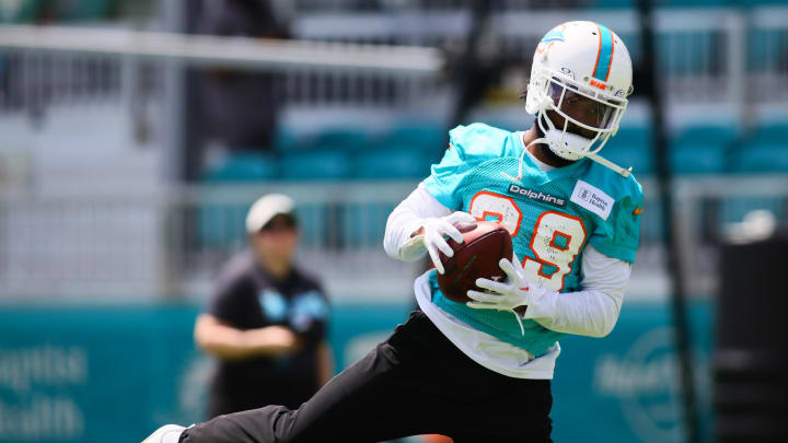 Jun 4, 2024; Miami Gardens, FL, USA; Miami Dolphins cornerback Kendall Fuller (29) catches the football during mandatory minicamp at Baptist Health Training Complex.