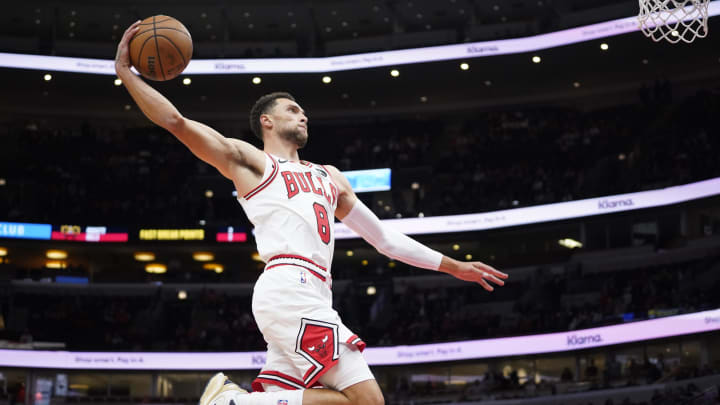 Oct 12, 2023; Chicago, Illinois, USA; Chicago Bulls guard Zach LaVine (8) goes up for a dunk against the Denver Nuggets during the first half at United Center. 