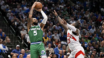 Oct 26, 2025; Dallas, Texas, USA; Dallas Mavericks guard D'Angelo Russell (5) makes a jump shot over Toronto Raptors guard Jamal Shead (23) during the second half at the American Airlines Center. Mandatory Credit: Jerome Miron-Imagn Images
