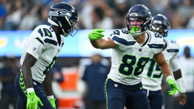 Seattle Seahawks tight end AJ Barner (88) gestures to teammates against the Los Angeles Chargers.