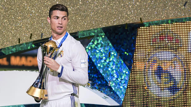 Cristiano Ronaldo with the old Club World Cup trophy.
