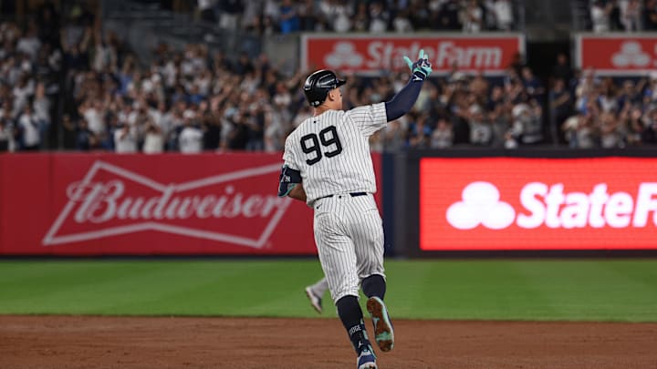 New York Yankees center fielder Aaron Judge (99) celebrates while running the bases after hitting a grand slam home run during the seventh inning against the Boston Red Sox at Yankee Stadium on Sept 13.