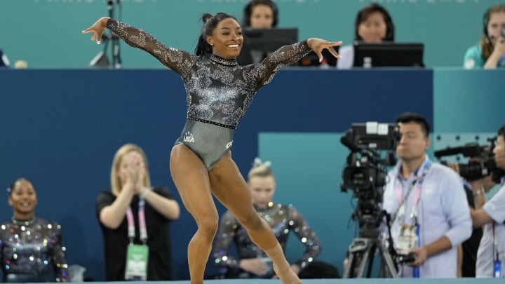 Jul 28, 2024; Paris, France; Simone Biles of the United States performs on the floor exercise in womenís qualification during the Paris 2024 Olympic Summer Games at Bercy Arena. Mandatory Credit: Kyle Terada-USA TODAY Sports