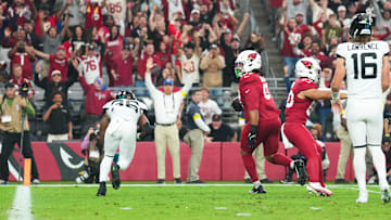 Nov 23, 2025; Glendale, Arizona, USA;  Arizona Cardinals defensive tackle Walter Nolen III (97) returns a fumble for a touchdown during the first quarter against the Jacksonville Jaguars at State Farm Stadium. Mandatory Credit: Joe Camporeale-Imagn Images