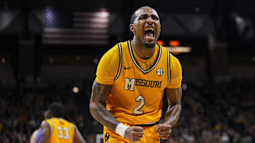 Dec 8, 2024; Columbia, Missouri, USA; Missouri Tigers guard Tamar Bates (2) celebrates after a play against the Kansas Jayhawks during the first half at Mizzou Arena. Mandatory Credit: Jay Biggerstaff-Imagn Images