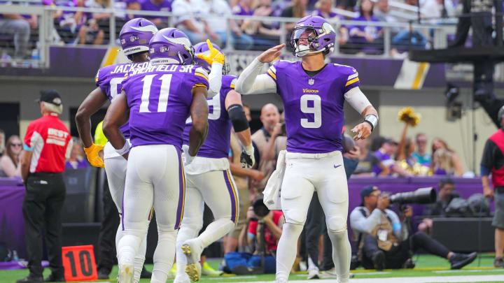 Minnesota Vikings quarterback J.J. McCarthy (9) celebrates his touchdown pass to wide receiver Trent Sherfield Sr. (11) against the Las Vegas Raiders in the third quarter at U.S. Bank Stadium in Minneapolis on Aug. 10, 2024.