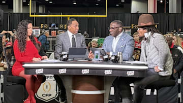 The hosts of ESPN First Take, Molly Qerim, Stephen A. Smith, Shannon Sharpe and Cam Newton, at the CFP Fan Central