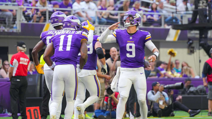 Aug 10, 2024; Minneapolis, Minnesota, USA; Minnesota Vikings quarterback J.J. McCarthy (9) celebrates wide receiver Trent Sherfield Sr. (11) touchdown against the Las Vegas Raiders in the third quarter at U.S. Bank Stadium.