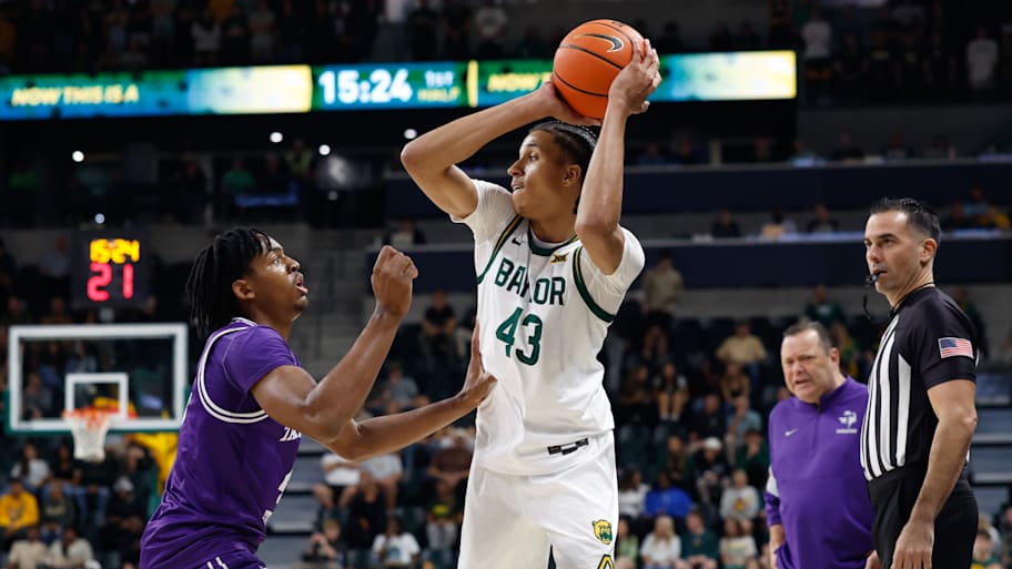 Baylor guard Cameron Carr controls the ball as Tarleton State Texans guard Leroy Kelly IV defends.