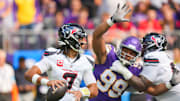 Sep 22, 2024; Minneapolis, Minnesota, USA; Houston Texans quarterback C.J. Stroud (7) drops back to pass against the Minnesota Vikings defensive tackle Jerry Tillery (99) in the first quarter at U.S. Bank Stadium. Mandatory Credit: Brad Rempel-Imagn Images