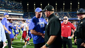 Kansas Jayhawks head coach Lance Leipold shakes hands with Fresno State Bulldogs head coach Matt Entz.