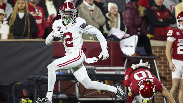 Alabama defensive back Zabien Brown eludes a tackle by Oklahoma quarterback John Mateer.
