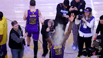Feb 1, 2025; New York, New York, USA; Los Angeles Lakers forward LeBron James (23) throws chalk into the air before the start of a game against the New York Knicks at Madison Square Garden. Mandatory Credit: Brad Penner-Imagn Images