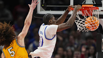 Dec 7, 2025; Kansas City, Missouri, USA; Kansas Jayhawks forward Flory Bidunga (40) dunks the ball against Missouri Tigers guard T.O. Barrett (5) during the second half at T-Mobile Center. Mandatory Credit: Jay Biggerstaff-Imagn Images
