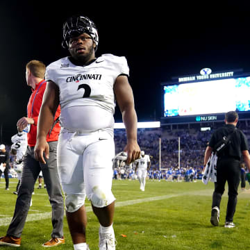 Cincinnati Bearcats defensive lineman Dontay Corleone (2) and the Cincinnati Bearcats walk off the field at the conclusion of a college football game between the Brigham Young Cougars and the Cincinnati Bearcats, Saturday, Sept. 30, 2023, at LaVell Edwards Stadium in Provo, Utah.