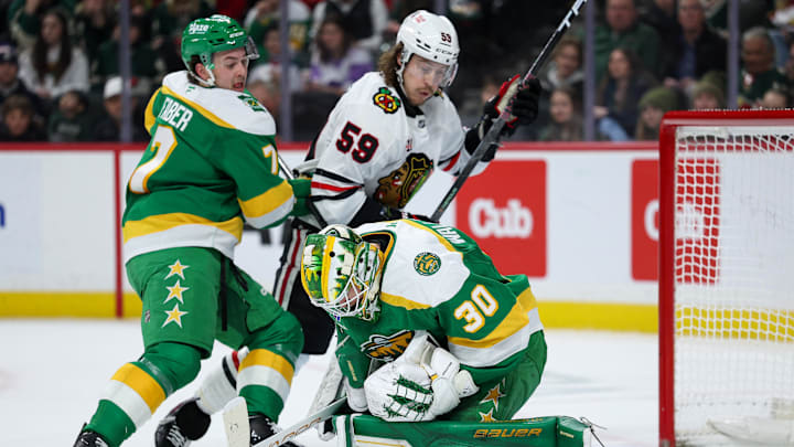 Jan 27, 2026; Saint Paul, Minnesota, USA; Minnesota Wild goaltender Jesper Wallstedt (30) makes a save against the Chicago Blackhawks during the first period at Grand Casino Arena. Mandatory Credit: Matt Krohn-Imagn Images